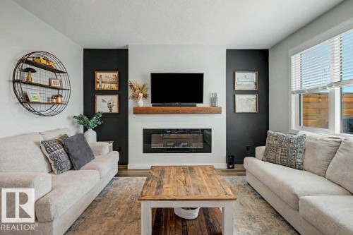 243 Brickyard Cove, Stony Plain, AB - Indoor Photo Showing Living Room With Fireplace