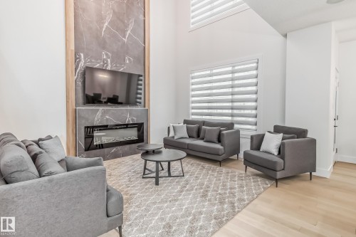 5380 Kimball Place Sw, Edmonton, AB - Indoor Photo Showing Living Room With Fireplace