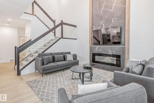5380 Kimball Place Sw, Edmonton, AB - Indoor Photo Showing Living Room With Fireplace