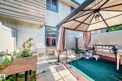 Private patio area featuring a metal gazebo with integrated lighting - 