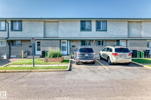 Townhome exterior with stucco and horizontal siding - 243 Abbotsfield Road Nw, Edmonton, AB - Outdoor