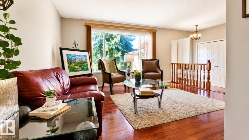 Bright living area featuring wide plank wood-finish flooring - 1022 106 Street Nw, Edmonton, AB - Indoor Photo Showing Living Room