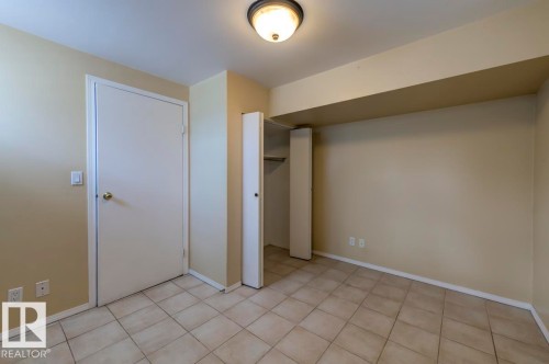 Neutral tone walls with a flush-mount ceiling light - 8511 64 Avenue, Edmonton, AB - Indoor Photo Showing Other Room