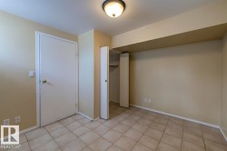 Neutral tone walls with a flush-mount ceiling light - 
