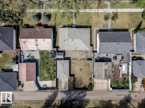 Overhead perspective showcasing multiple residential properties, each featuring individual rear yards - 8511 64 Avenue, Edmonton, AB - Outdoor