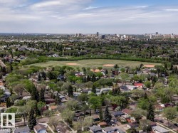 Aerial perspective showcasing a residential area with mature trees - 