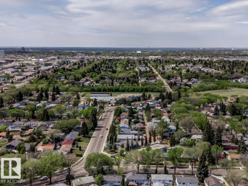 Aerial perspective showcasing a residential area with mature trees and established streets - 8511 64 Avenue, Edmonton, AB - Outdoor With View