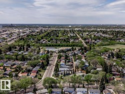 Aerial perspective showcasing a residential area with mature trees and established streets - 