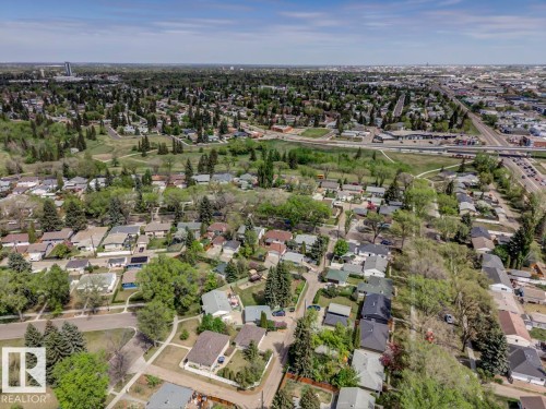 Expansive aerial perspective showcasing a residential area with varied housing styles and mature trees - 8511 64 Avenue, Edmonton, AB - Outdoor With View