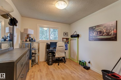 Room with wood-finish flooring, a double-pane window, and neutral wall paint - 13211 77 Street Nw, Edmonton, AB - Indoor Photo Showing Other Room