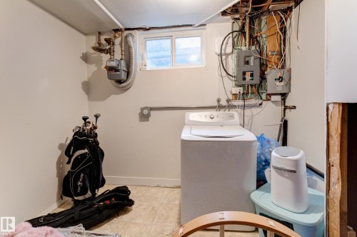 Basement utility area featuring a window, painted walls, and tiled flooring - 13211 77 Street Nw, Edmonton, AB - Indoor Photo Showing Other Room