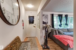 Entryway with wood-finish flooring and a flush-mount ceiling light - 