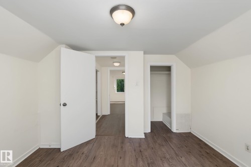 Room featuring wood-finish flooring, white walls, and a recessed ceiling light - 11147 78 Avenue Nw, Edmonton, AB 