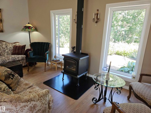 56320 Range Road 102A, Rural St. Paul County, AB - Indoor Photo Showing Living Room With Fireplace