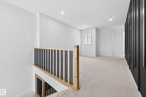 Landing area featuring light-toned carpeting and recessed lighting - 431 172 Avenue, Edmonton, AB - Indoor Photo Showing Other Room