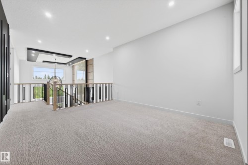 Loft area featuring textured carpeting, white walls, and recessed lighting - 431 172 Avenue, Edmonton, AB - Indoor Photo Showing Other Room