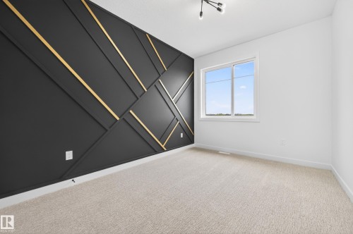 Feature wall with geometric black and gold paneling - 431 172 Avenue, Edmonton, AB - Indoor Photo Showing Other Room