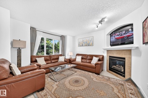1126 Grantham Drive Nw, Edmonton, AB - Indoor Photo Showing Living Room With Fireplace
