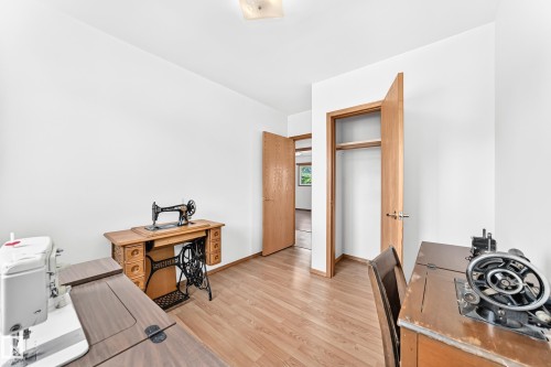 Bright room featuring light wood-finish flooring, white walls, and a recessed ceiling light - 10819 137 Avenue Nw, Edmonton, AB - Indoor Photo Showing Office