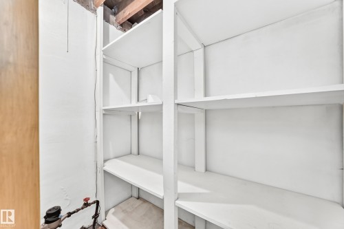 Built-in shelving with multiple storage levels - 10819 137 Avenue Nw, Edmonton, AB - Indoor