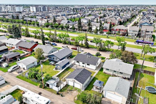 Aerial perspective showcasing residential properties with established landscaping - 10819 137 Avenue Nw, Edmonton, AB - Outdoor With View
