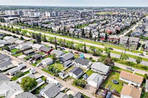 Aerial perspective showcasing a residential neighborhood with diverse housing styles - 10819 137 Avenue Nw, Edmonton, AB - Outdoor With View