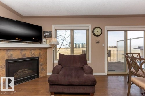 #134 5420 Grant Macewan Bv, Leduc, AB - Indoor Photo Showing Living Room With Fireplace