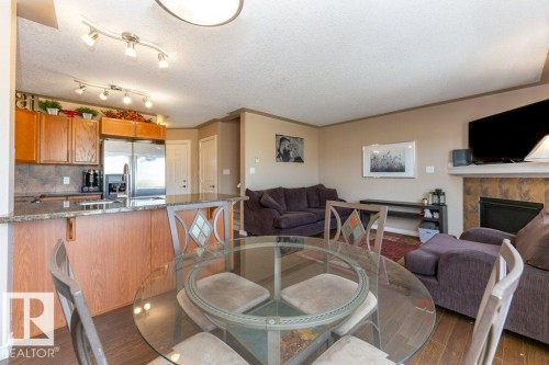 #134 5420 Grant Macewan Bv, Leduc, AB - Indoor With Fireplace