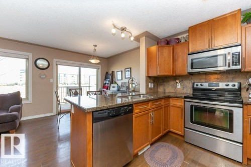 #134 5420 Grant Macewan Bv, Leduc, AB - Indoor Photo Showing Kitchen With Double Sink