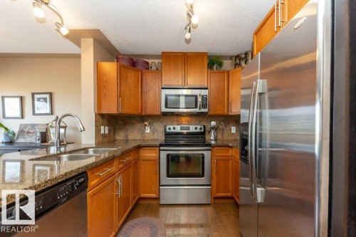 #134 5420 Grant Macewan Bv, Leduc, AB - Indoor Photo Showing Kitchen With Double Sink