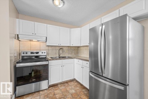 5212 50 Avenue, Bruderheim, AB - Indoor Photo Showing Kitchen With Stainless Steel Kitchen With Double Sink
