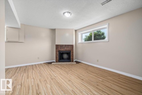 5212 50 Avenue, Bruderheim, AB - Indoor Photo Showing Living Room With Fireplace