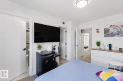 White interior walls with wall-mounted television - 