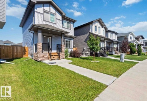 Contemporary two-story residence with light blue siding and dark gray trim - 17924 61 Street Nw, Edmonton, AB - Outdoor