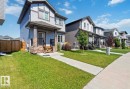 Contemporary two-story residence with light blue siding and dark gray trim - 17924 61 Street Nw, Edmonton, AB  - Outdoor 