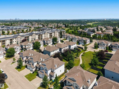 Aerial perspective showcasing a residential community with varied architectural styles - #64 120 Magrath Rd Nw, Edmonton, AB - Outdoor With View