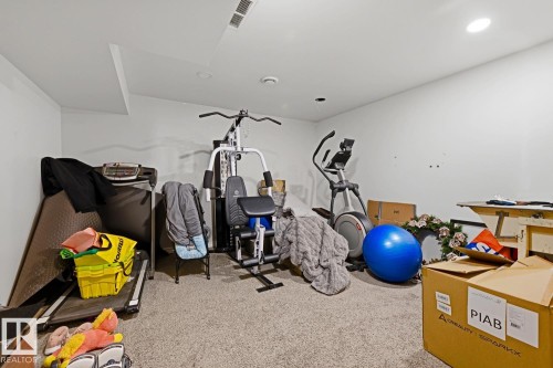 Spacious room featuring neutral carpet flooring and white painted walls - 3724 163 Avenue Nw, Edmonton, AB - Indoor Photo Showing Other Room
