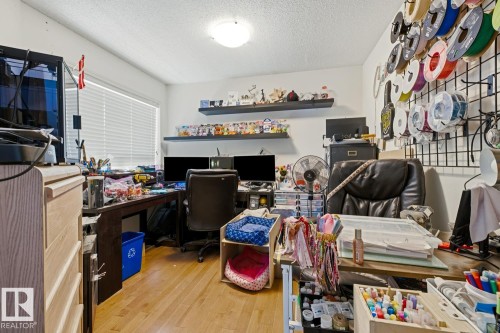 Light wood-finish flooring complements the neutral wall color - 3724 163 Avenue Nw, Edmonton, AB - Indoor