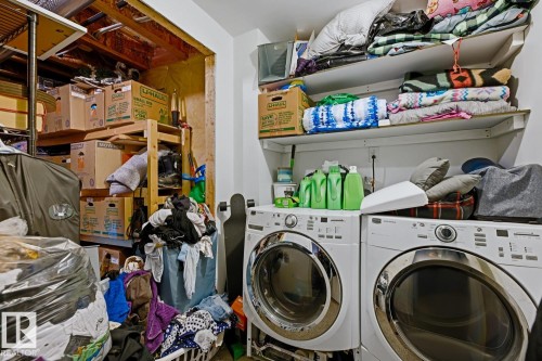 Front-load washer and dryer units with a white finish - 3724 163 Avenue Nw, Edmonton, AB - Indoor Photo Showing Laundry Room