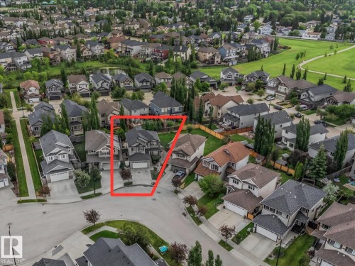 Two-story residence with an attached double garage and driveway - 13 Baie Madelene, Beaumont, AB - Outdoor With View