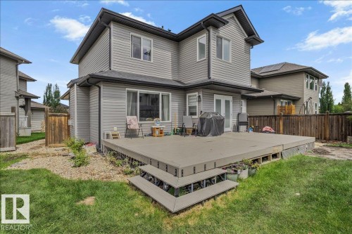 Spacious composite deck with steps to the lawn - 13 Baie Madelene, Beaumont, AB - Outdoor With Deck Patio Veranda