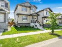 Contemporary two-story residence featuring light-colored siding with dark trim accents - 283 Ameena Drive, Leduc, AB  - Outdoor With Facade 
