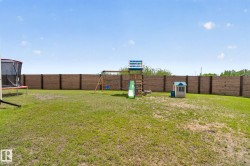 Expansive grass yard with a full privacy fence - 