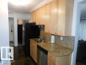 #101 10745 83 Av Nw, Edmonton, AB  - Indoor Photo Showing Kitchen With Double Sink 