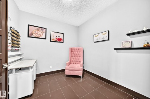 Neutral wall color with dark trim - 16244 138 Street Nw, Edmonton, AB - Indoor Photo Showing Other Room