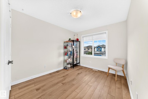 Bright room featuring wood-finish flooring and neutral wall tones - 16244 138 Street Nw, Edmonton, AB - Indoor Photo Showing Other Room