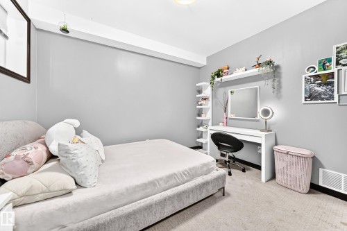 Wall-to-wall carpeting in a neutral tone with light gray walls - 16244 138 Street Nw, Edmonton, AB - Indoor Photo Showing Bedroom