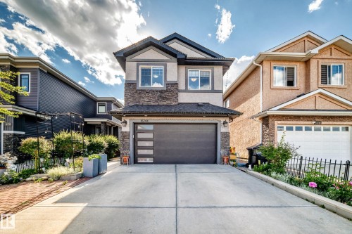 Modern two-story residence featuring a stone and stucco exterior - 16244 138 Street Nw, Edmonton, AB - Outdoor With Facade