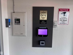 Integrated entry system featuring a digital display, key card reader, and call button - 