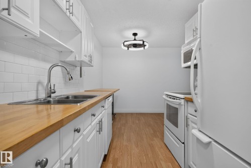 #108 10520 80 Av Nw, Edmonton, AB - Indoor Photo Showing Kitchen With Double Sink